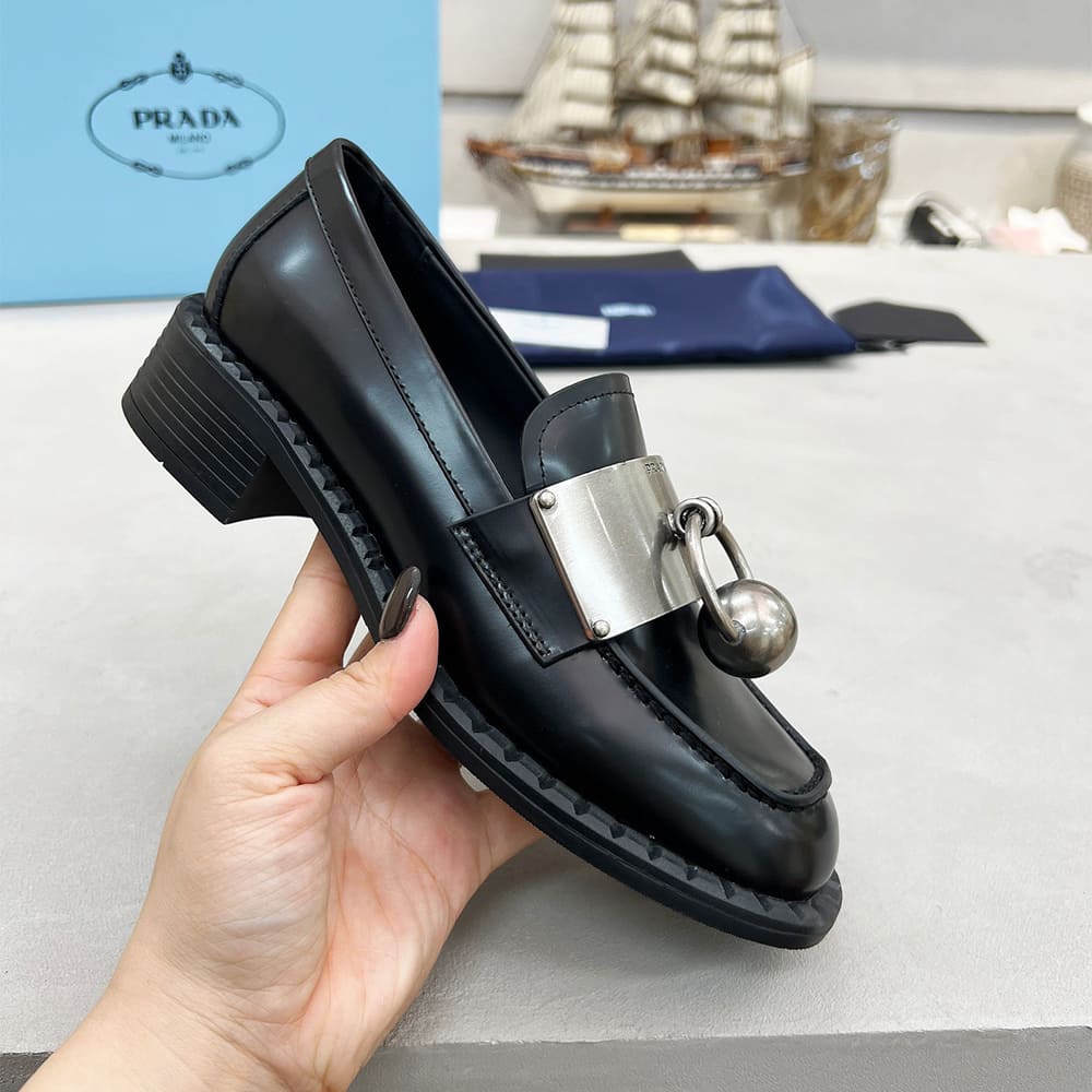 PRADA Brushed leather loafers with metal details