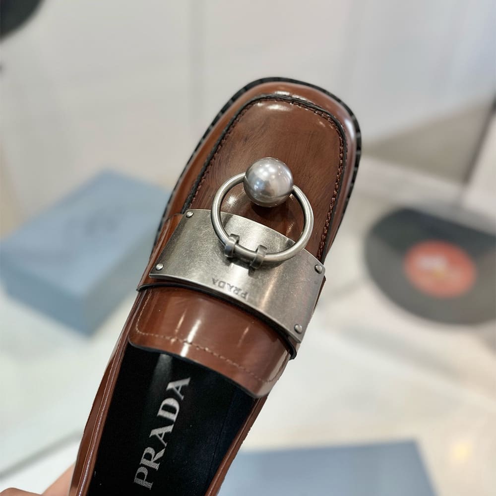 PRADA Brushed leather loafers with metal details