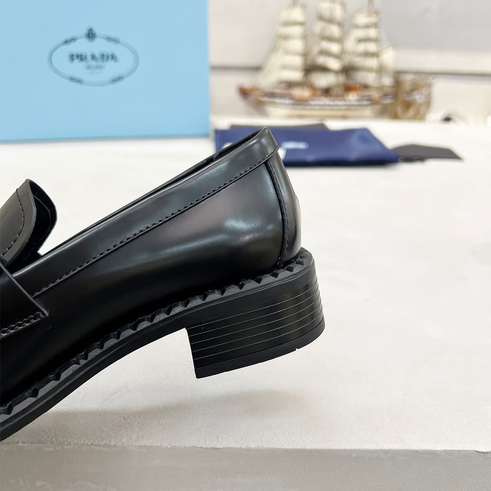 PRADA Brushed leather loafers with metal details